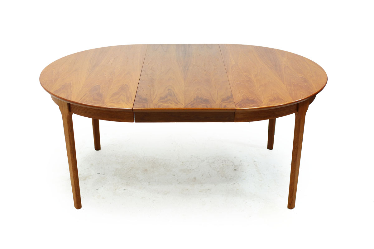 Mid Century Modern Round Extendable to Oval Teakwood Table with 2 leafs and notched leg system
