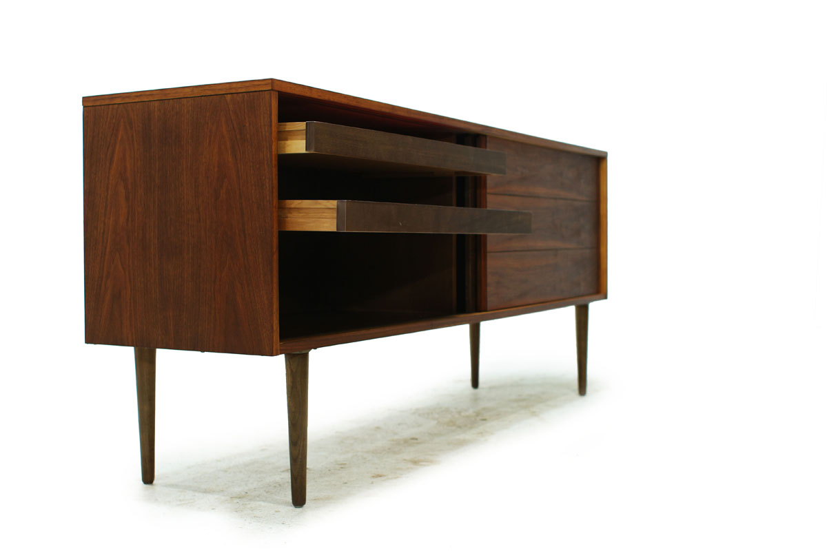 Sleek Walnut Mid Century Modern Wood Two Door Credenza with two drawers and tapered legs