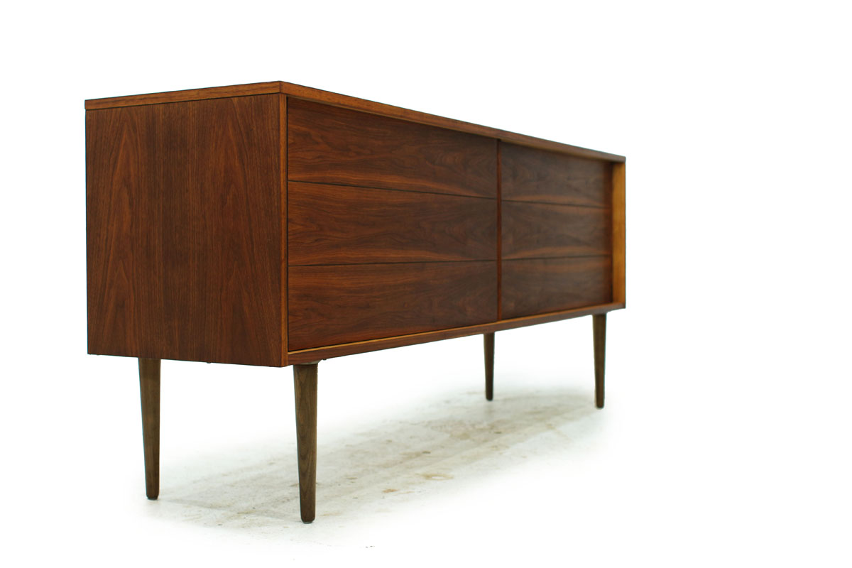 Sleek Walnut Mid Century Modern Wood Two Door Credenza with two drawers and tapered legs