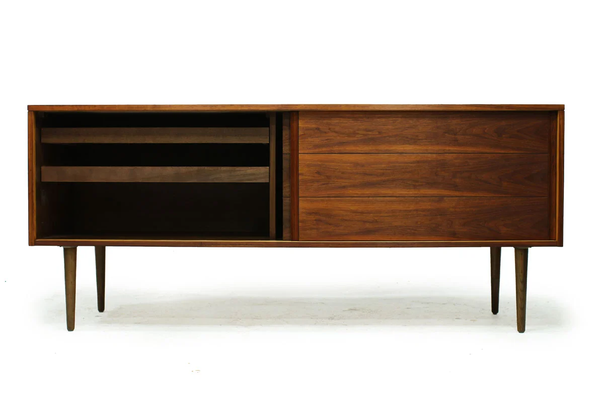 Sleek Walnut Mid Century Modern Wood Two Door Credenza with two drawers and tapered legs