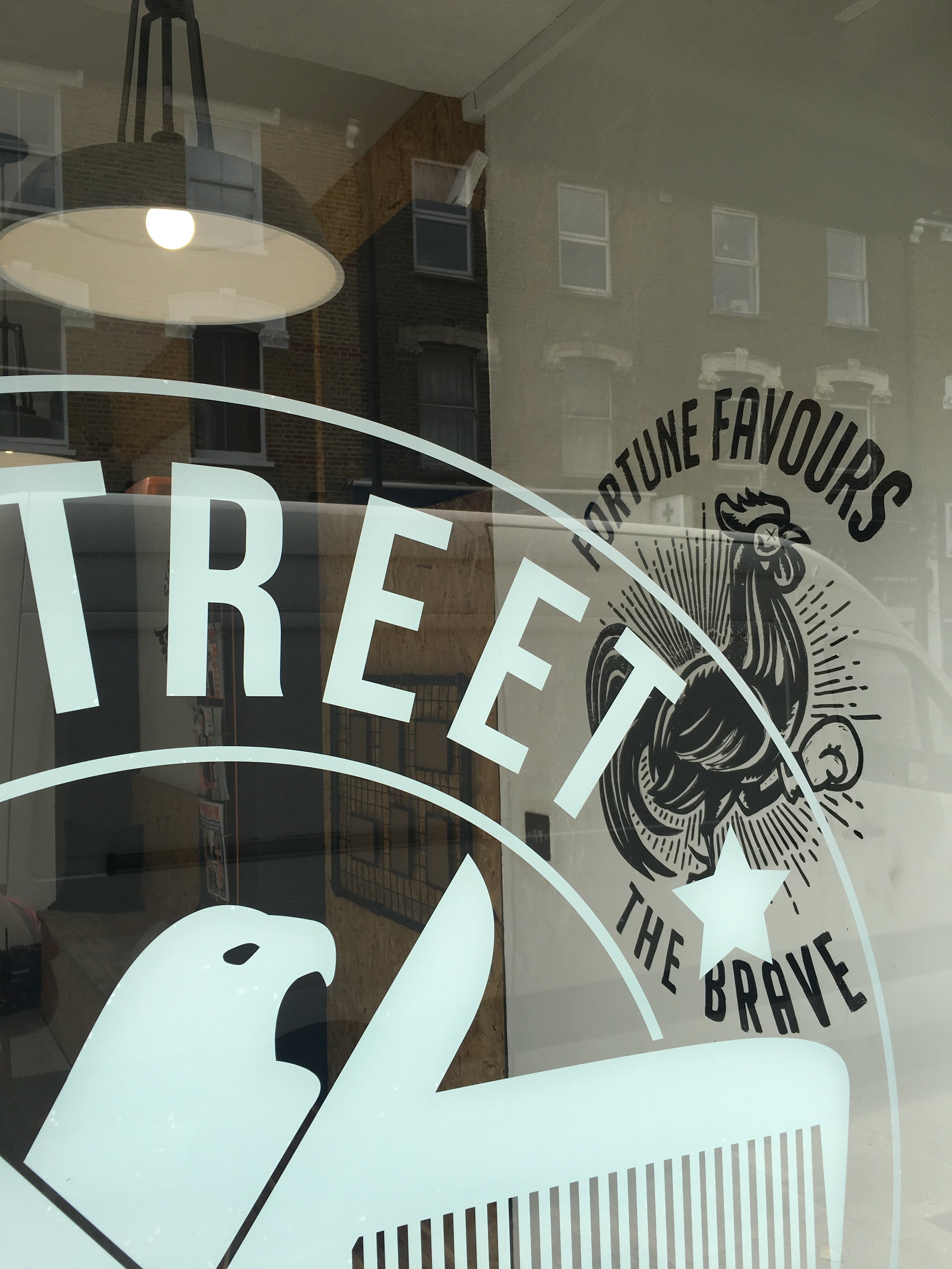 window logo at e-street barbers hackney