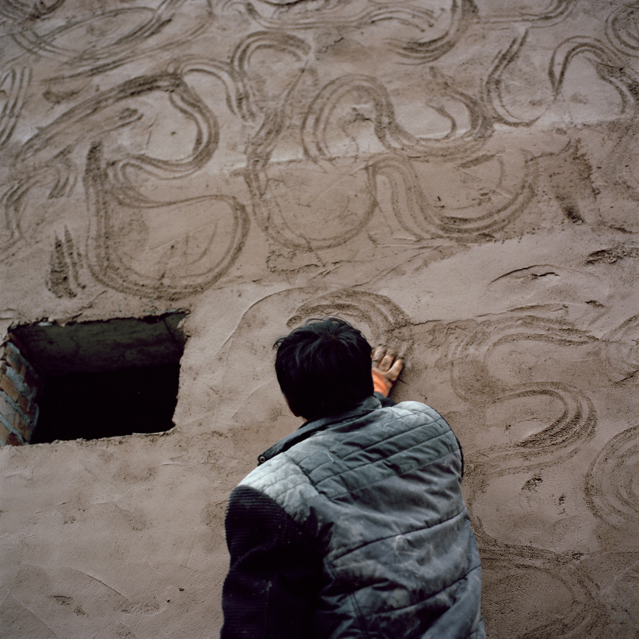 A Hired Han Worker Decorating the Exterior Walls of a Qiang Family's House, Radish Village, Sichuan, China, March 2016