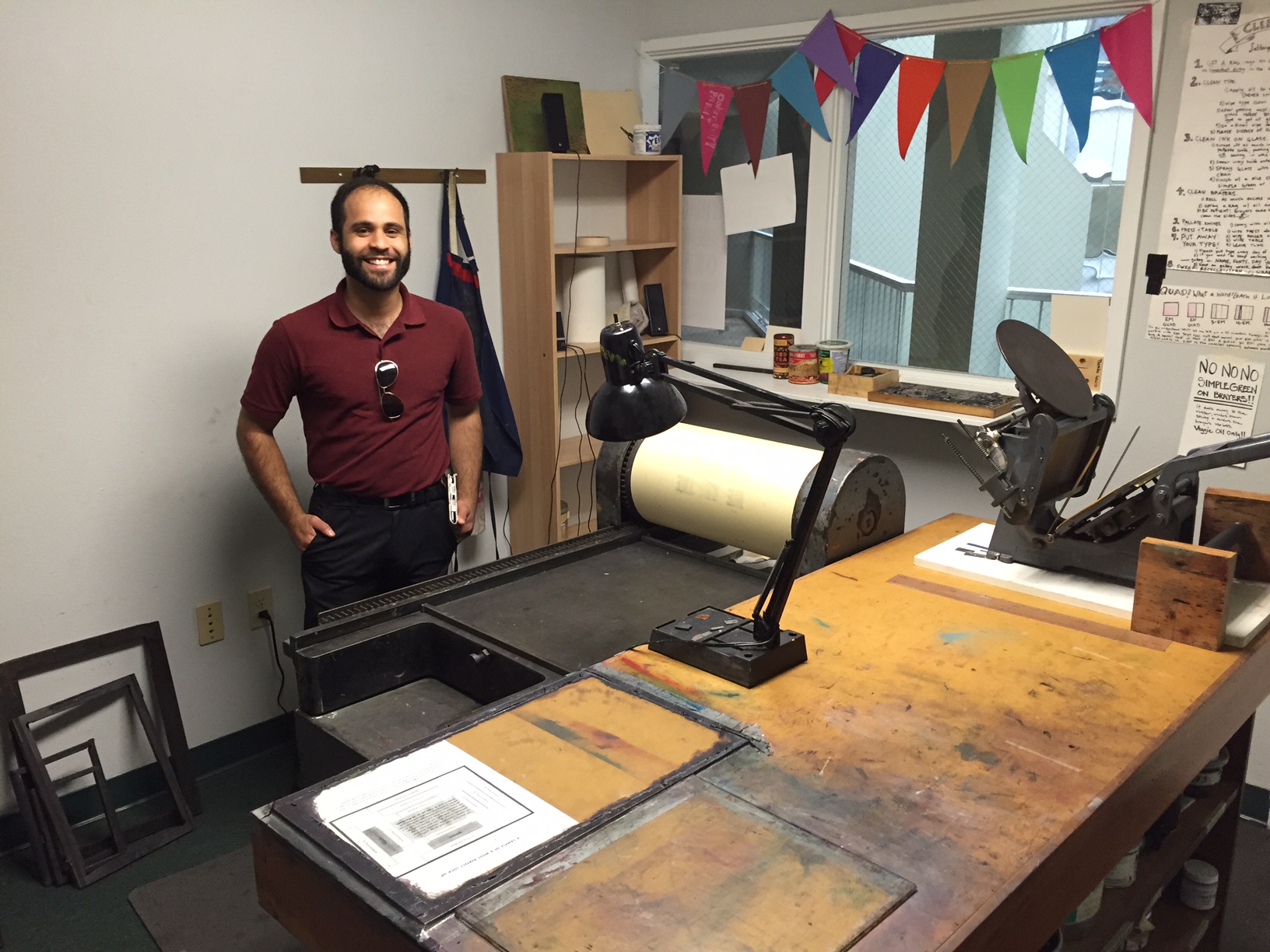 Genemichal Lauria in front of a huge letterpress!