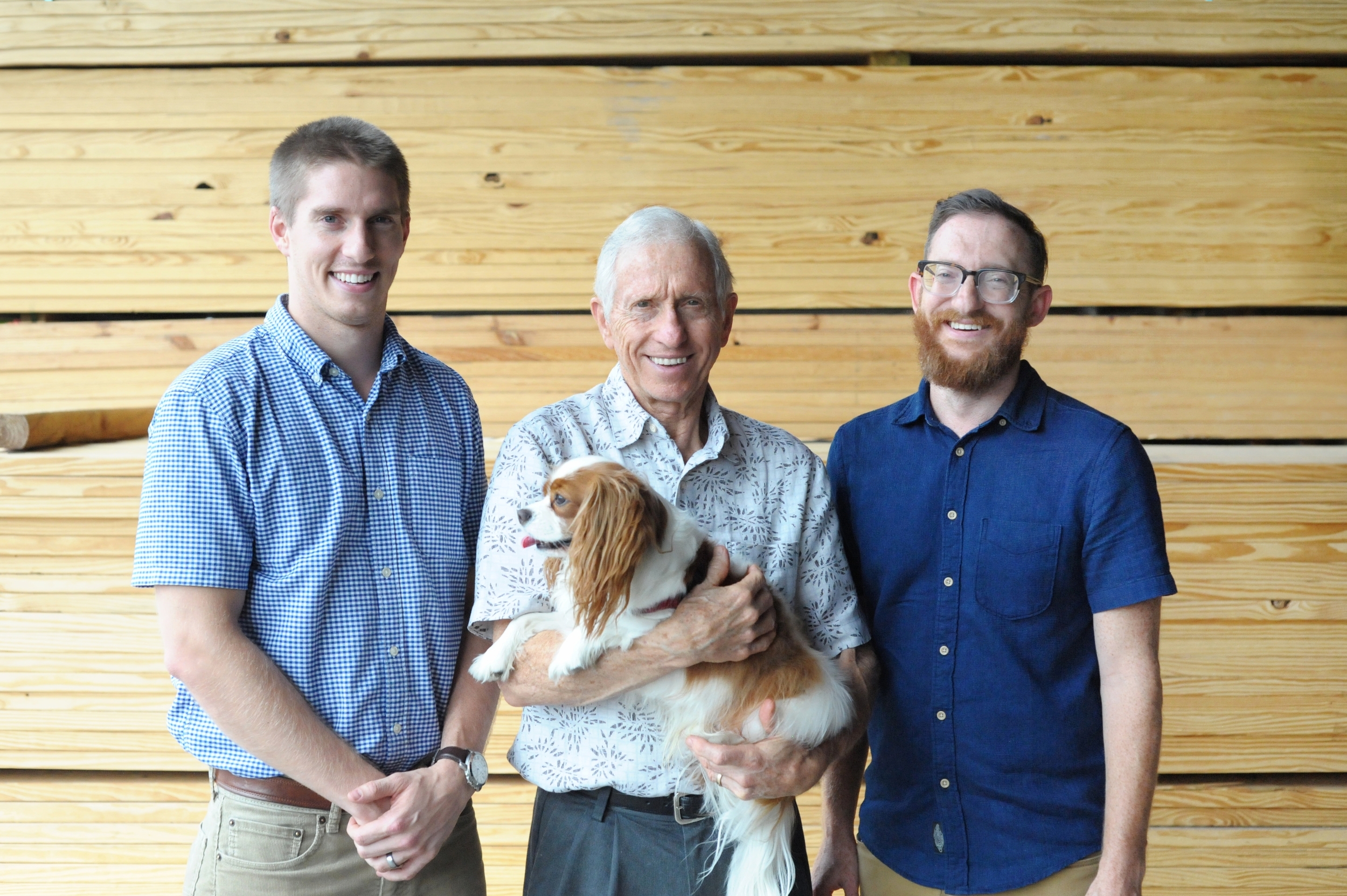 Owner Jim Huskey with his sons Taylor and Austin Huskey and dog, Winston.