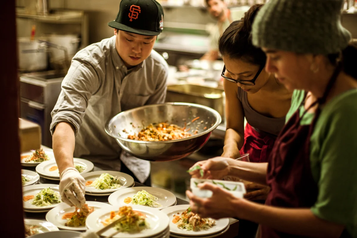eric and katie laying out salads.jpg