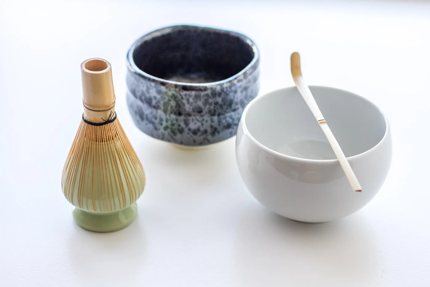 My chasen (matcha bamboo whisk) on its holder, my two chawans (matcha tea bowls) and bamboo tea scoop (chashaku).