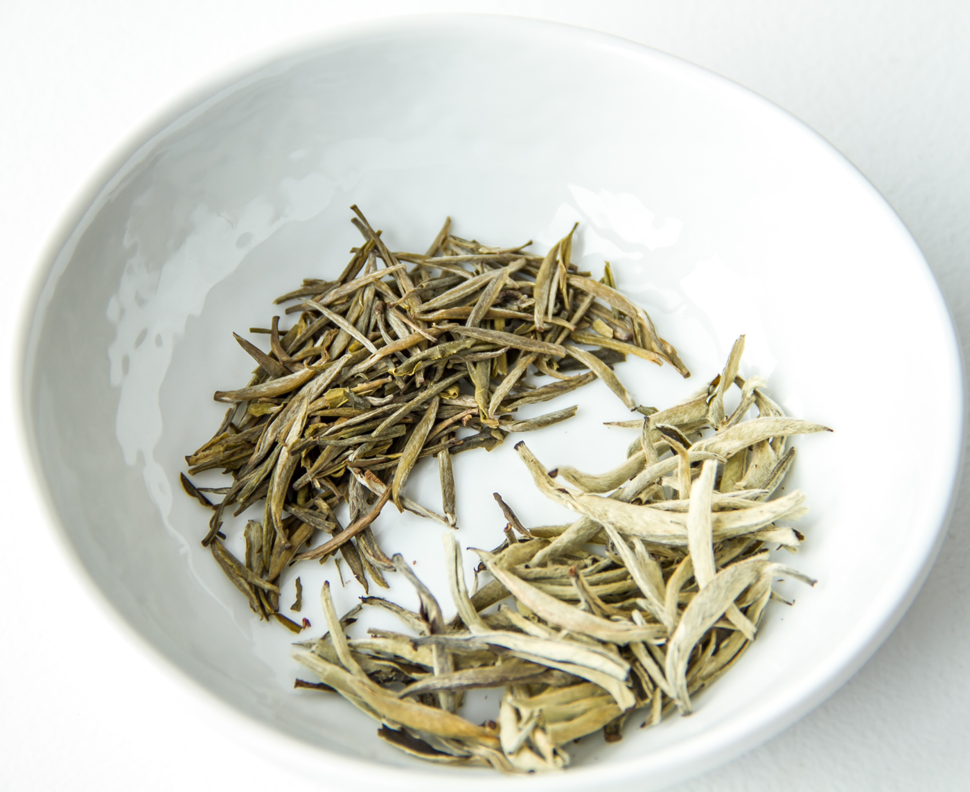 Yin Zhen yellow tea (top/left) and Yin Zhen white tea (bottom/right)