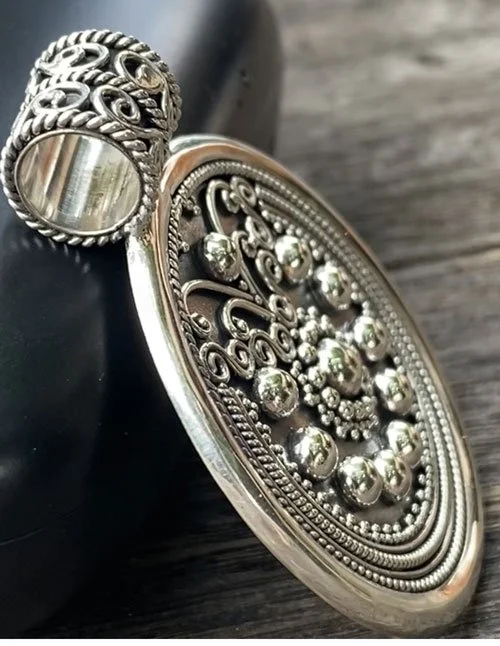 silver pendant, Balinese jewelry, granulation design, handcrafted, sterling silver, sunburst pendant, traditional craftsmanship, circular medallion, artisan jewelry,