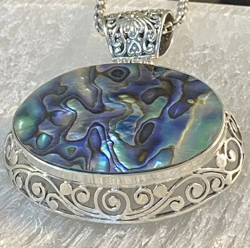 abalone, pendant, sterling silver, Balinese jewelry, handcrafted, iridescent shell, ocean-inspired, artisanal, Bali,