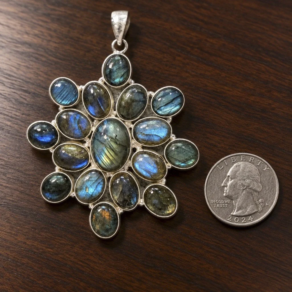 Natural labradorite statement pendant with multiple blue and green flash gemstones in silver setting