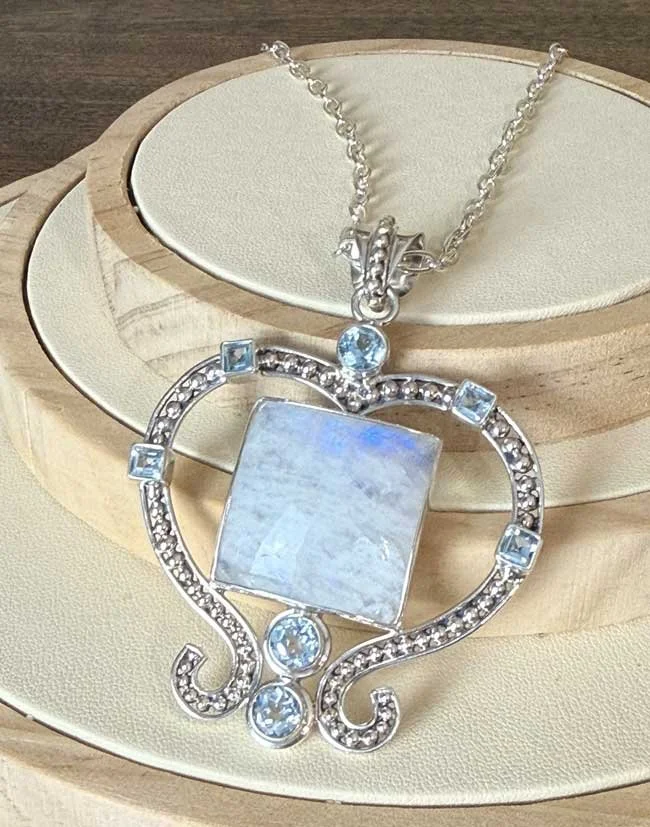 Sterling silver moonstone and blue topaz heart pendant