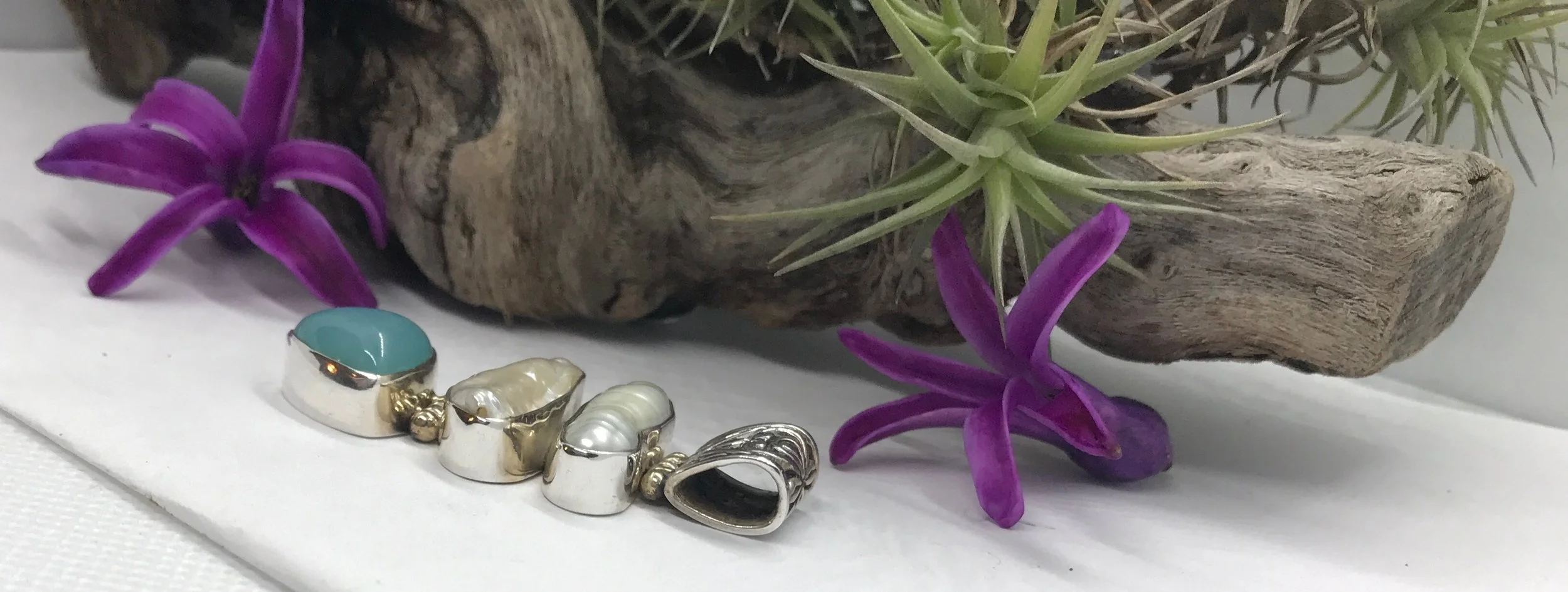 Boho artisan necklace featuring natural pearl and blue chalcedony set in sterling silver