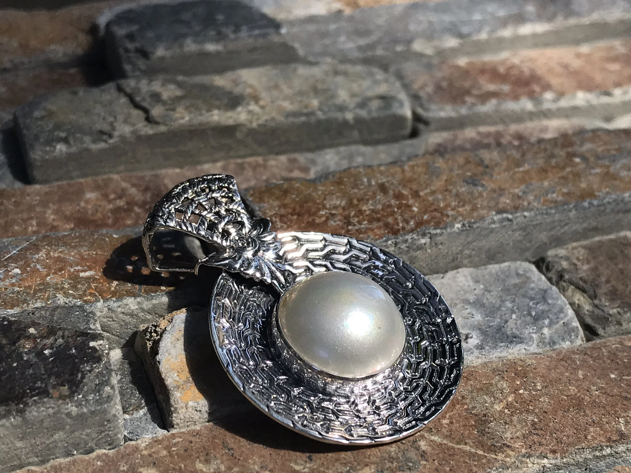 mother of pearl pendant set in sterling silver from Bali