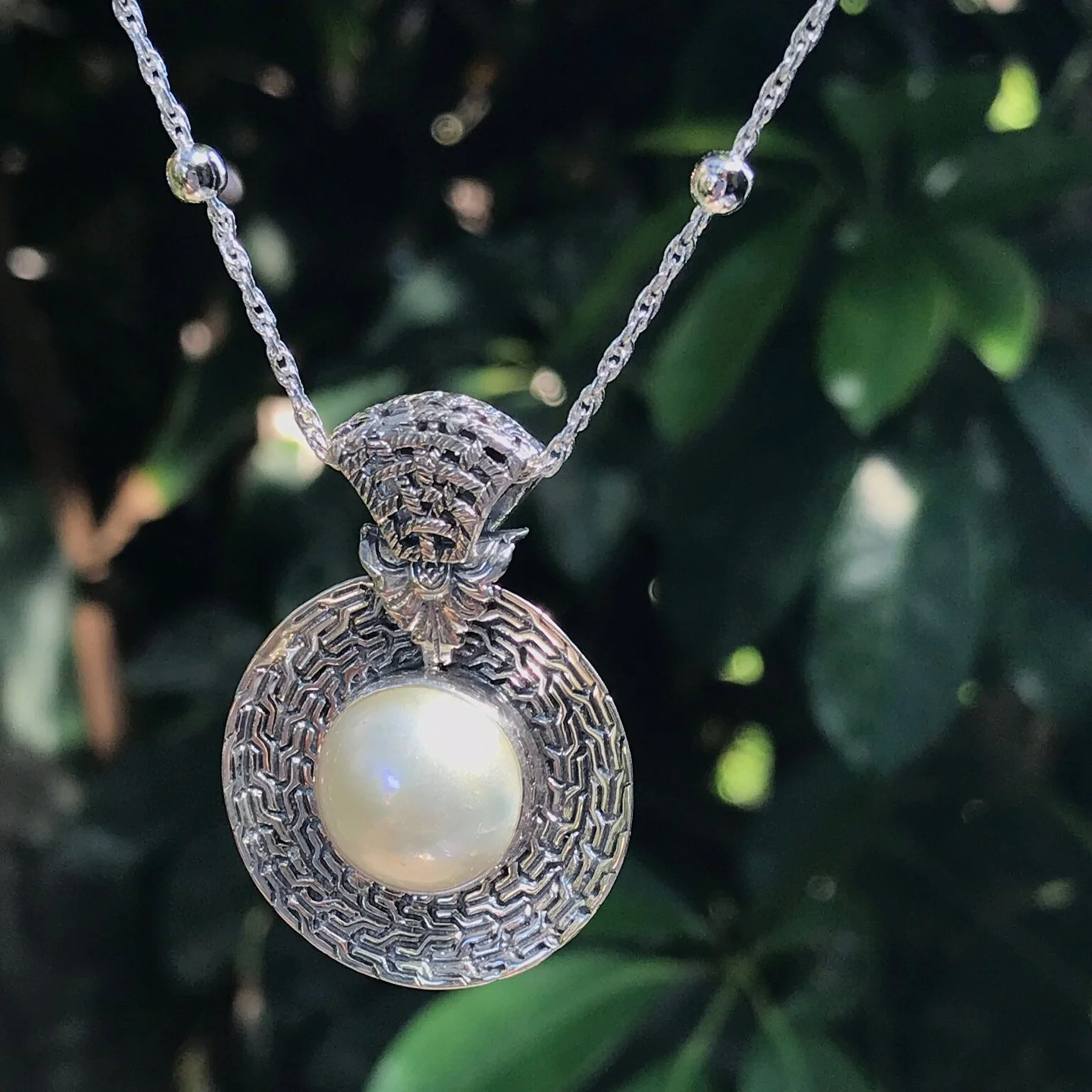 mother of pearl pendant set in sterling silver from Bali