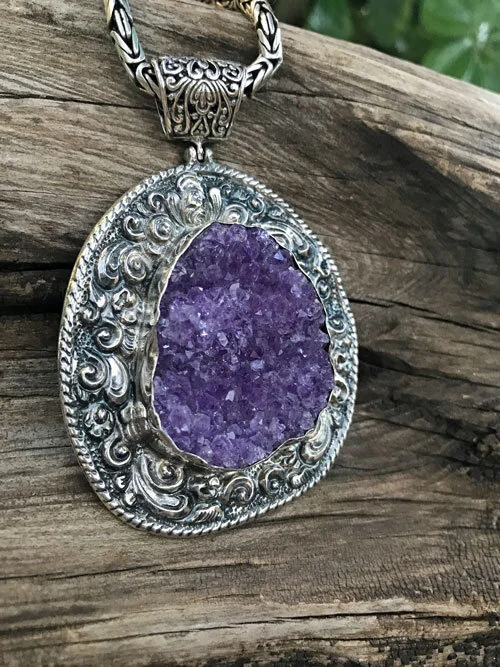 unpolished, rough amethyst gemstone pendant set in sterling silver