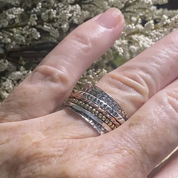 spinner ring, also known as a fidget, anxiety or meditation ring, is designed to help alleviate stress and anxiety