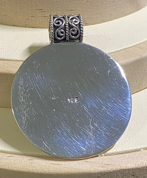 silver pendant, Balinese jewelry, granulation design, handcrafted, sterling silver, sunburst pendant, traditional craftsmanship, circular medallion, artisan jewelry, intricate details