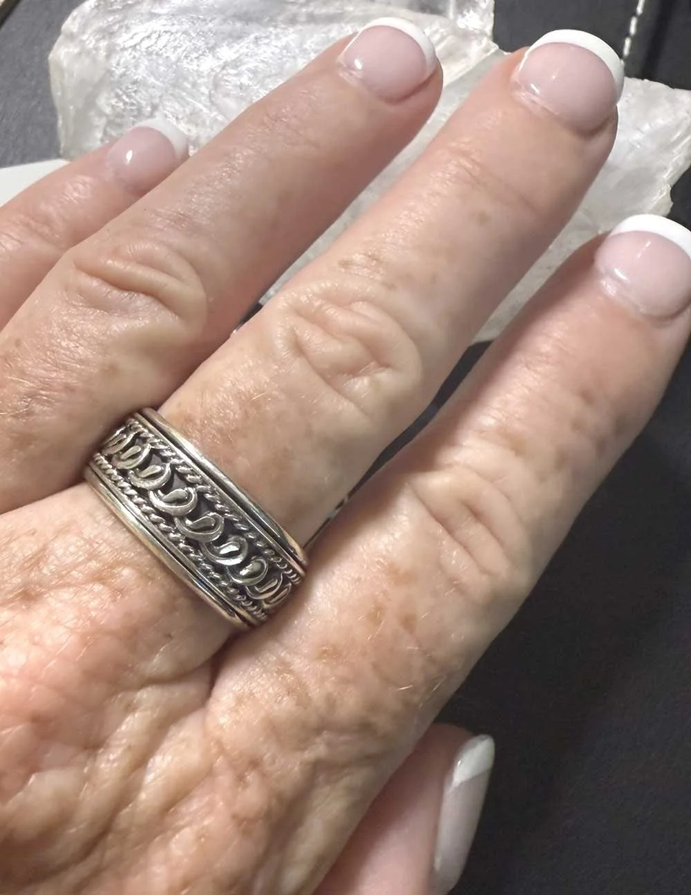 Sterling silver Tibetan prayer wheel spinner ring with intricate scrollwork, handmade in Bali for mindfulness and anxiety relief