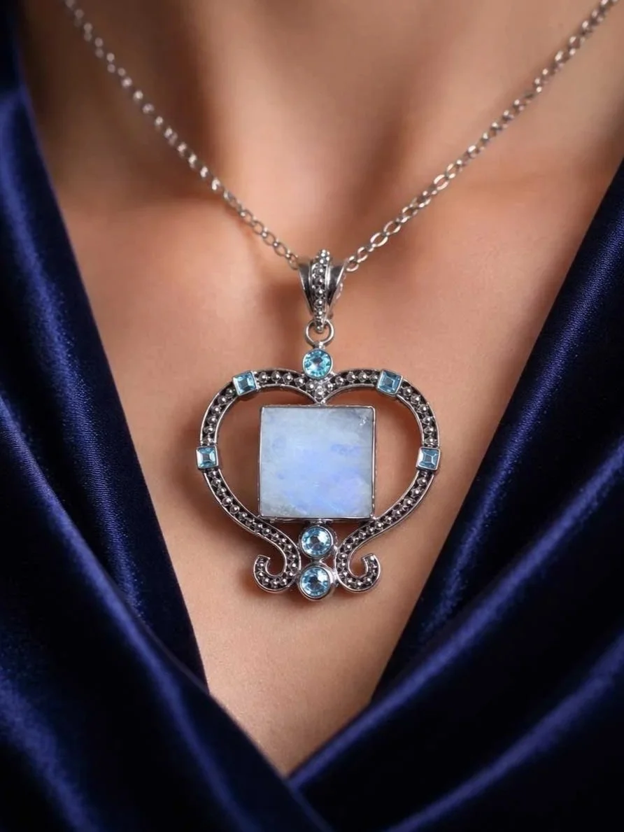 Sterling silver moonstone and blue topaz heart pendant