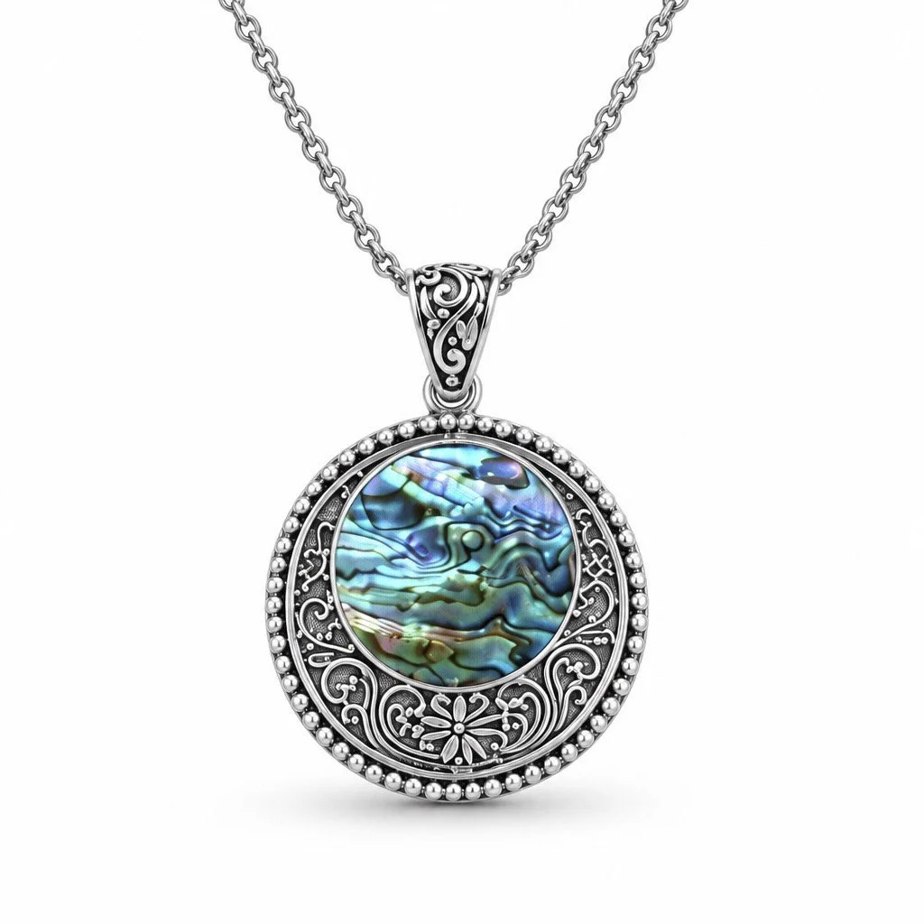 Natural abalone shell sterling silver pendant with intricate Bali silver scrollwork and detailed bail