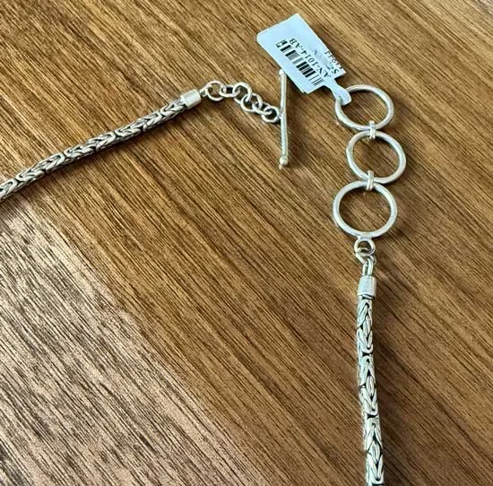 Handcrafted sterling silver abalone shell necklace with luminous ocean colors. Artisan statement jewelry inspired by the sea and handmade in Bali.