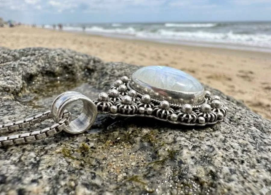 Sterling silver moonstone pendant with large luminous center stone