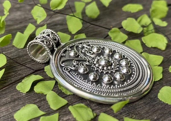 Boho chic, ethnic jewelry, statement piece, Bali silverwork, handmade pendant, silver medallion, elegant necklace, silver granules, timeless design, jewelry art