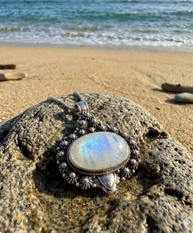 Sterling silver moonstone pendant with large luminous center stone