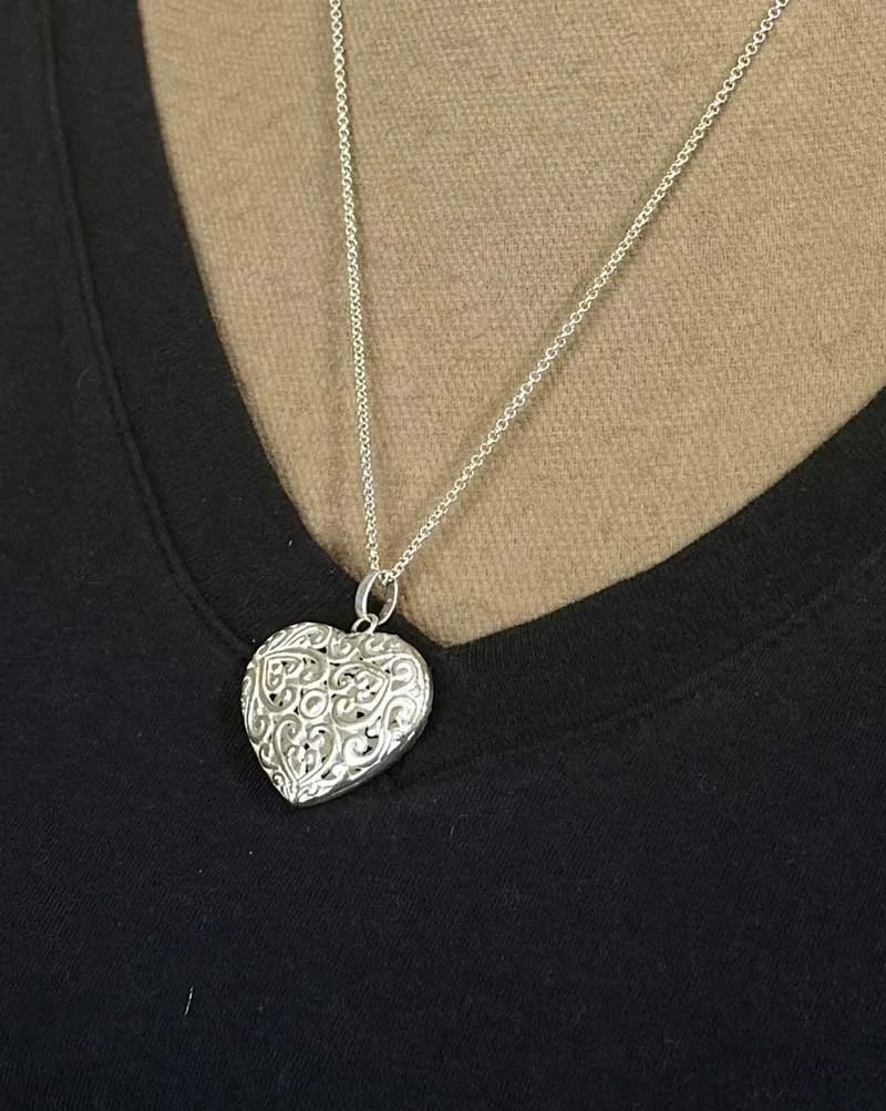 Boho style sterling silver heart pendant handmade with intricate design