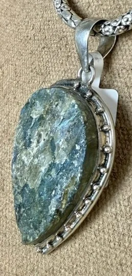 IHandmade sterling silver Labradorite pendant with iridescent blue-green fire. A Boho artisan gemstone necklace for protection, creativity, and style.
