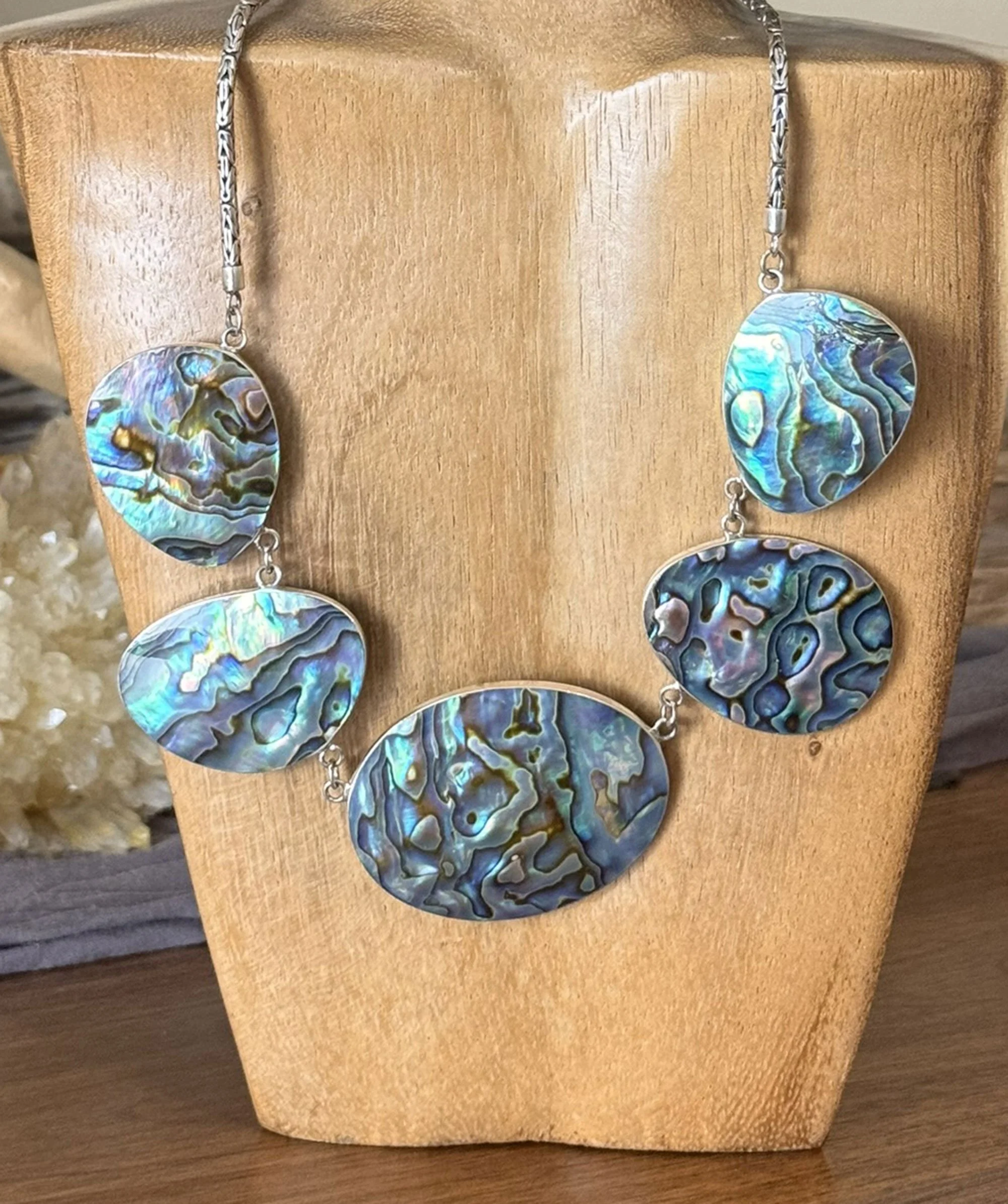 Handcrafted sterling silver abalone shell necklace with luminous ocean colors. Artisan statement jewelry inspired by the sea and handmade in Bali.
