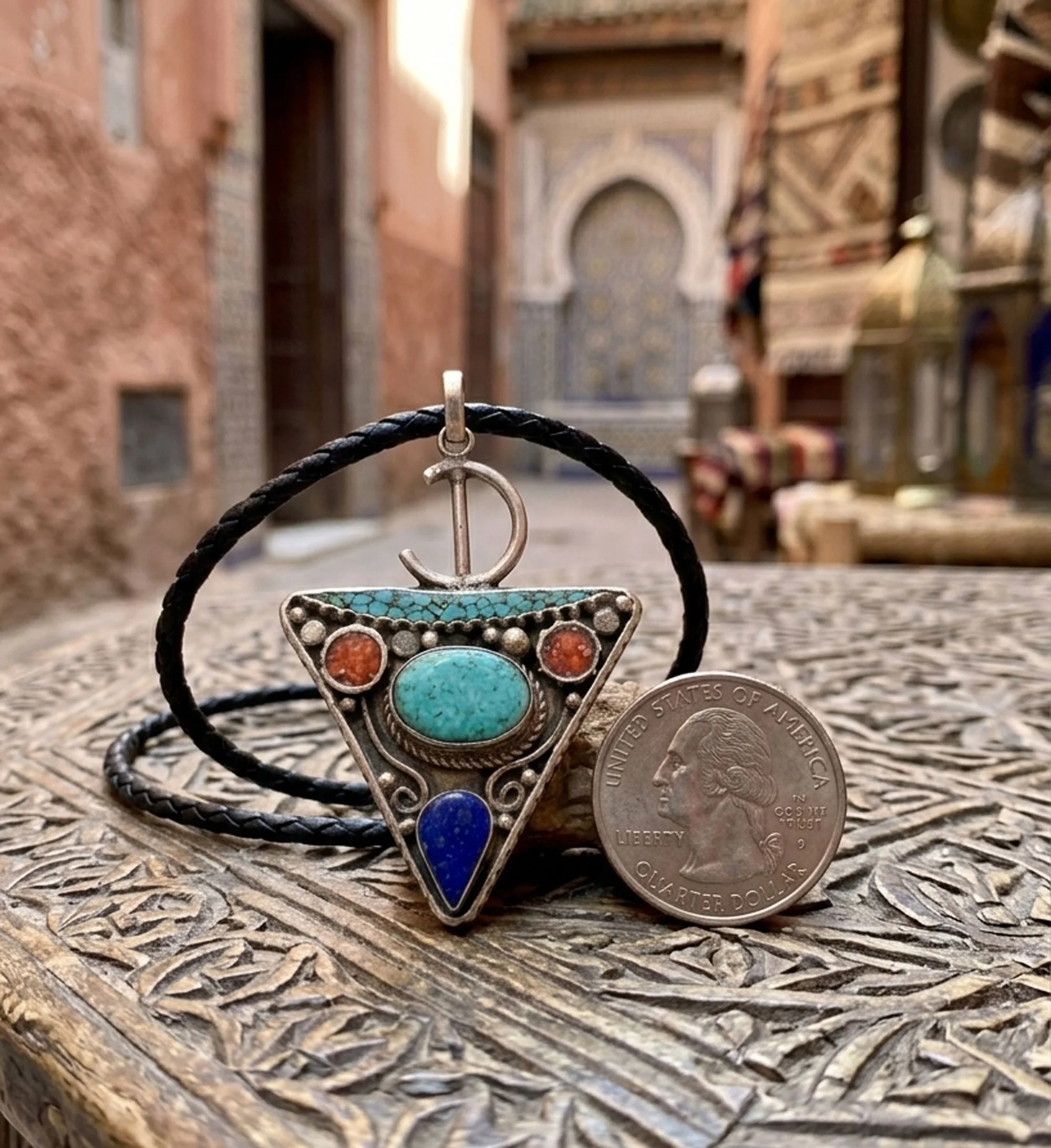 Handcrafted sterling silver gemstone pendant inspired by travel and artisan craftsmanship.