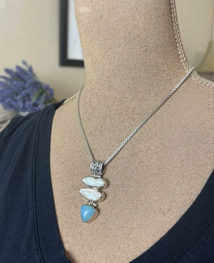 Blue chalcedony and pearl gemstone pendant with detailed silver bail