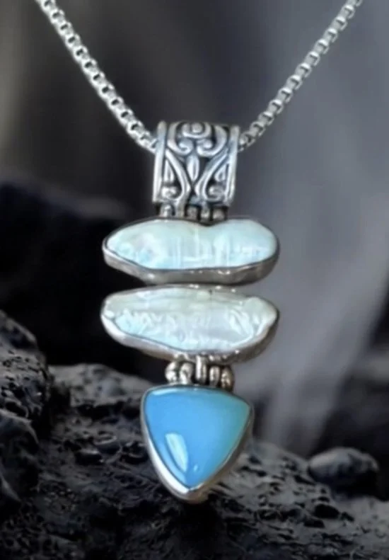 Boho artisan necklace featuring natural pearl and blue chalcedony set in sterling silver