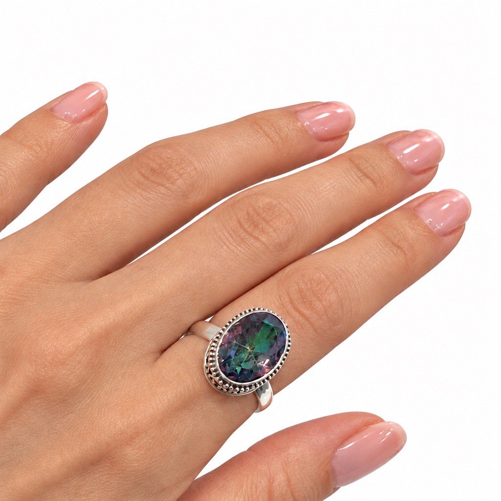Oval Mystic Topaz sterling silver ring size 10 featuring multicolor gemstone and intricate scrollwork setting.