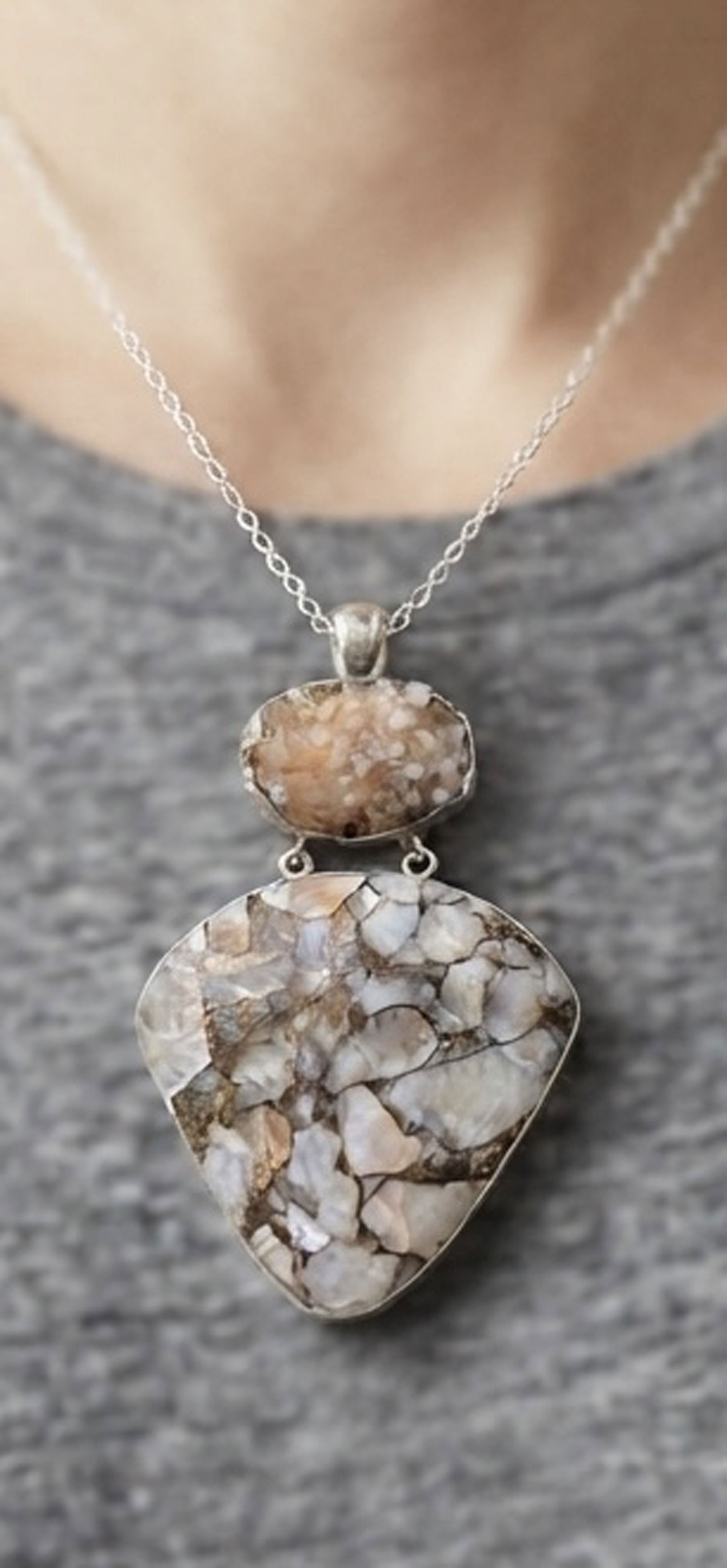 Woman wearing one-of-a-kind Calcite sterling silver pendant