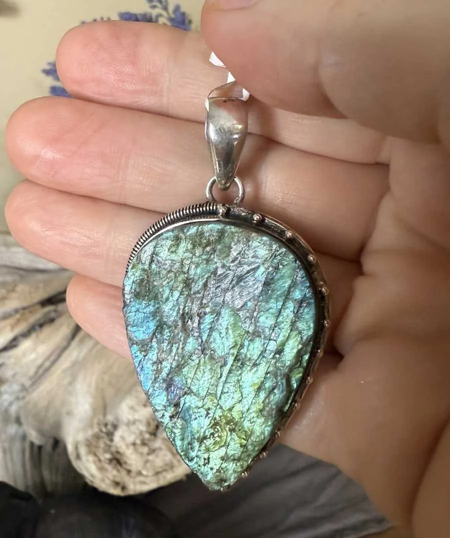 Handmade sterling silver Labradorite pendant with iridescent blue-green fire. A Boho artisan gemstone necklace for protection, creativity, and style.