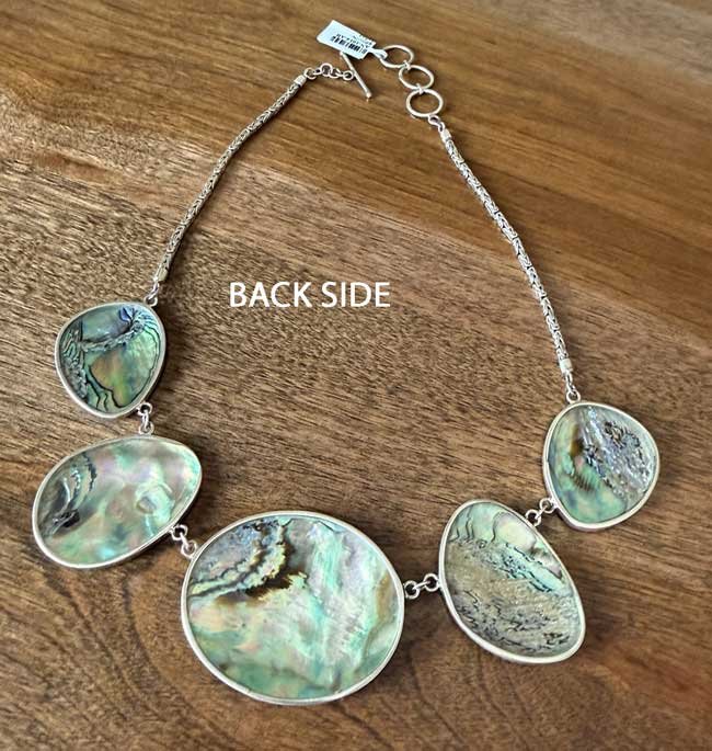 Handcrafted sterling silver abalone shell necklace with luminous ocean colors. Artisan statement jewelry inspired by the sea and handmade in Bali.