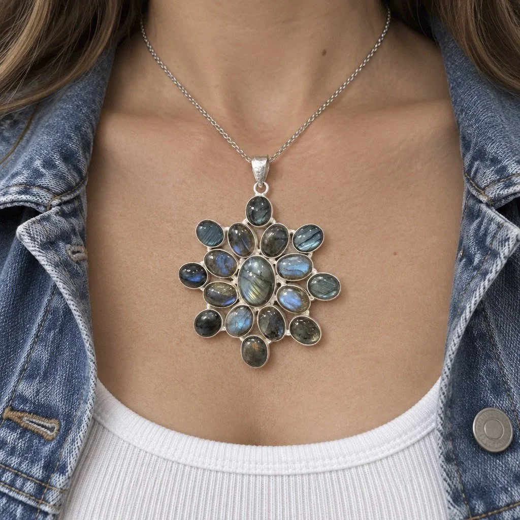 Labradorite gemstone statement pendant worn on silver chain with casual denim