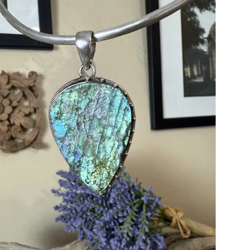 Handmade sterling silver Labradorite pendant with iridescent blue-green fire. A Boho artisan gemstone necklace for protection, creativity, and style.