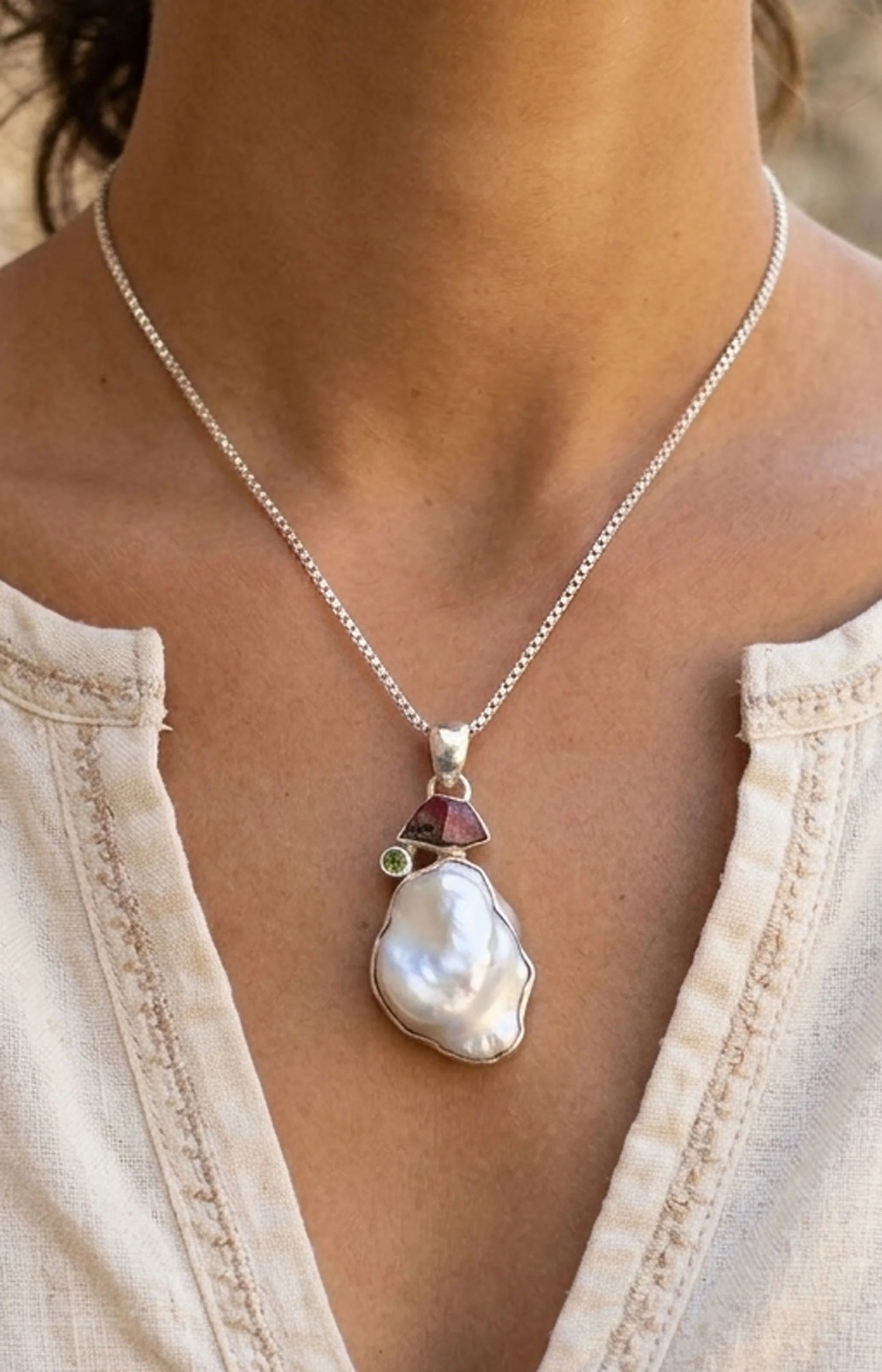 Baroque pearl and tourmaline sterling silver pendant necklace worn on model boho gemstone jewelry