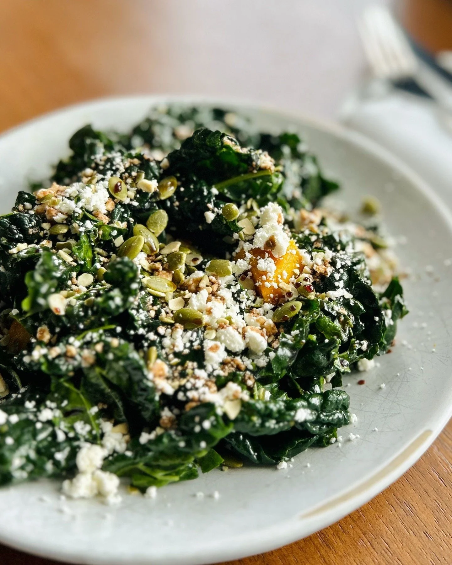 Seasonal kale glossed in a sweet and tangy saba vinaigrette, jeweled with pumpkin and flecks of feta. Pepitas scattered for crunch and warmth. Every bite a mix of crisp, creamy, sweet, and earthy&mdash;this is our take on a fall kale salad, now avail