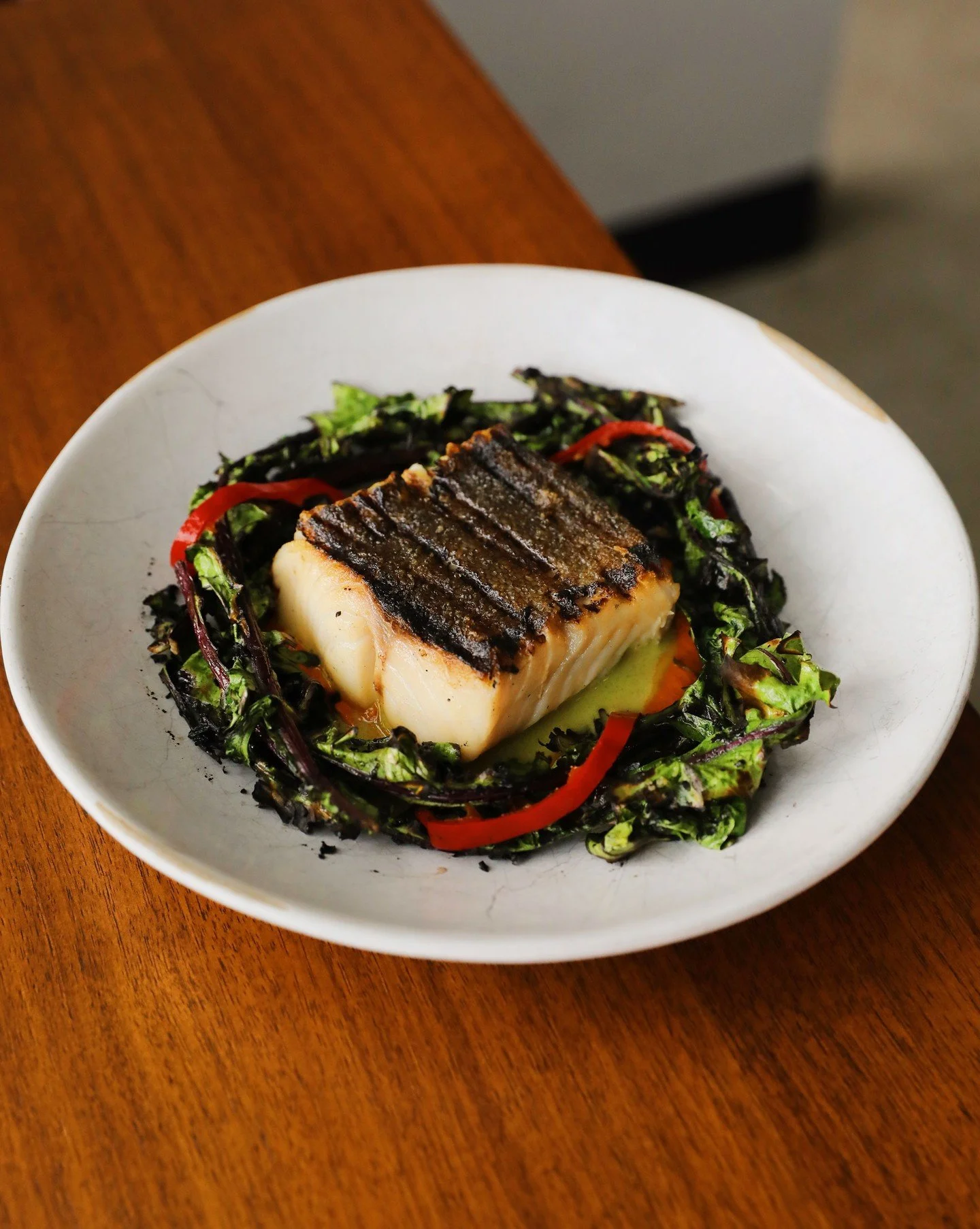 One of our favorites. Grilled black cod from our purveyor @eastanchorseafood with bright pickled Fresnos, silky charred fennel sofrito pur&eacute;e, dandelion greens, and a fresh summer green butter sauce.

Happy new year folks! ✨#generalharvestseatt