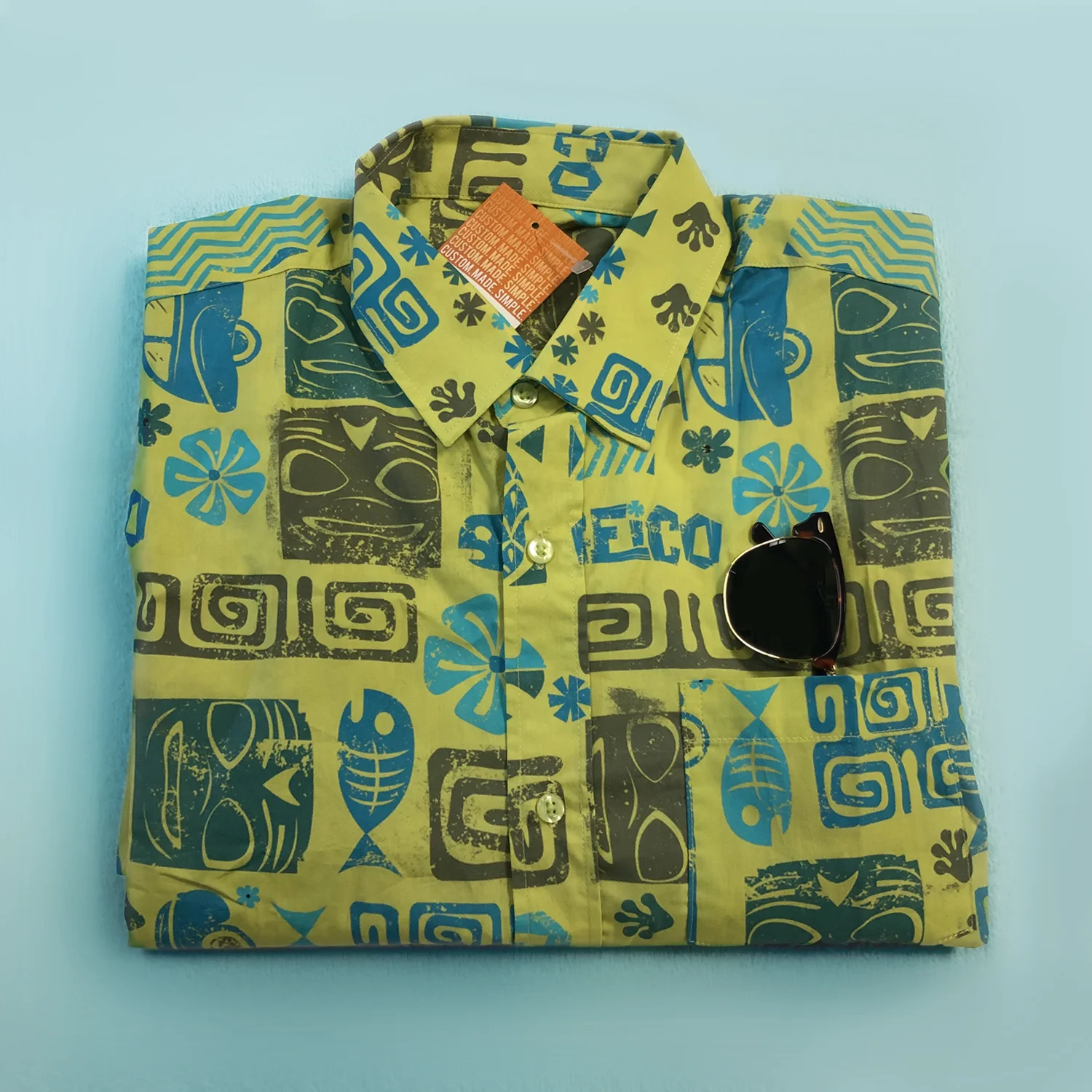 FoldedHawaiianShirt_withglasses_Blue.jpeg
