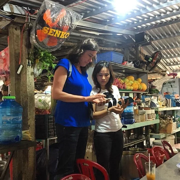 The picture of me with Tam, the Sinh Tố shop owner, shows how we are trying to understand each other using a translate app on our phones. Our apps are pretty hopeless, and we are frustrated! Tam’s sinh tố is in Hoi An. A place I visit twice a day when I am staying in Hoi An. She gives fresh healthy drinks at locals prices with a smile, kindness and empathy. I just love this place!