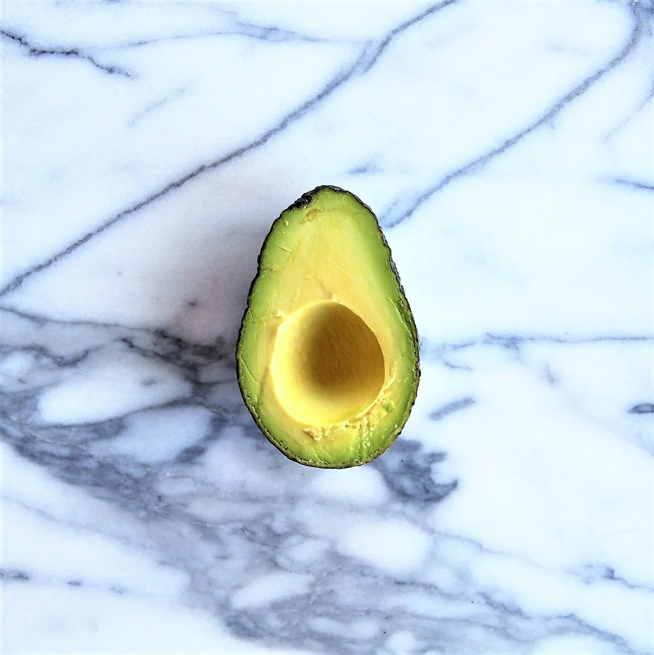 Use the half without the avocado pit or seed