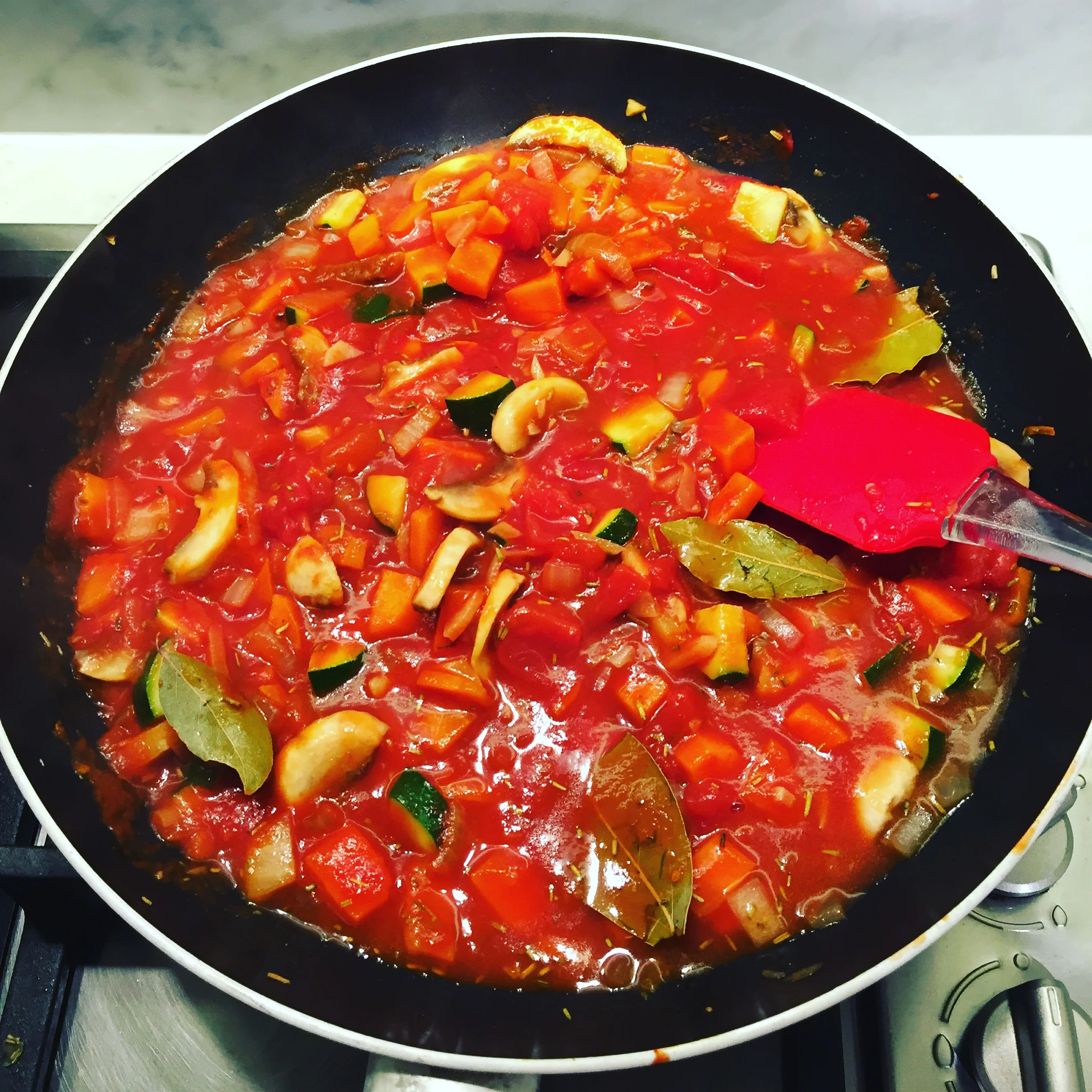 Pot pie mixture simmering on stove
