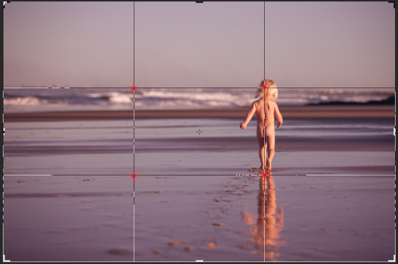 First of all the main subject is in the strong line position and the two crossing points. One of the points is exactly where I want everyone's eyes to focus, which is the feet. The horizon is also placed with one of the lines, which is pleasing to most.&nbsp;
