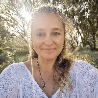 Maja Szumylo, founder of Emotional Photography and Naturopathy Gold Coast, smiling — passionate about capturing people’s light and supporting their wellbeing.