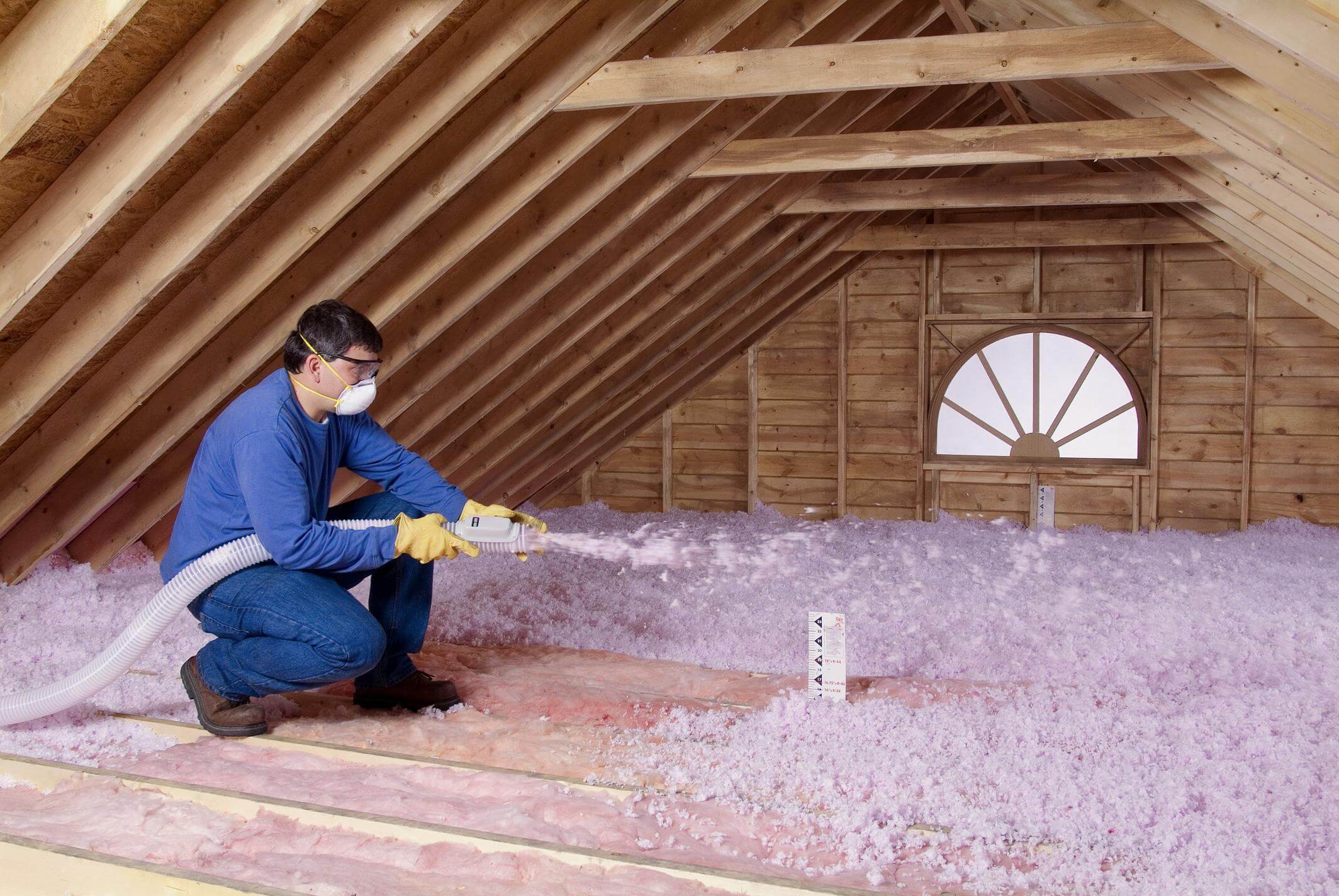 Contractor-Blowing-Insulation-in-an-unfinished-attic-1.jpg
